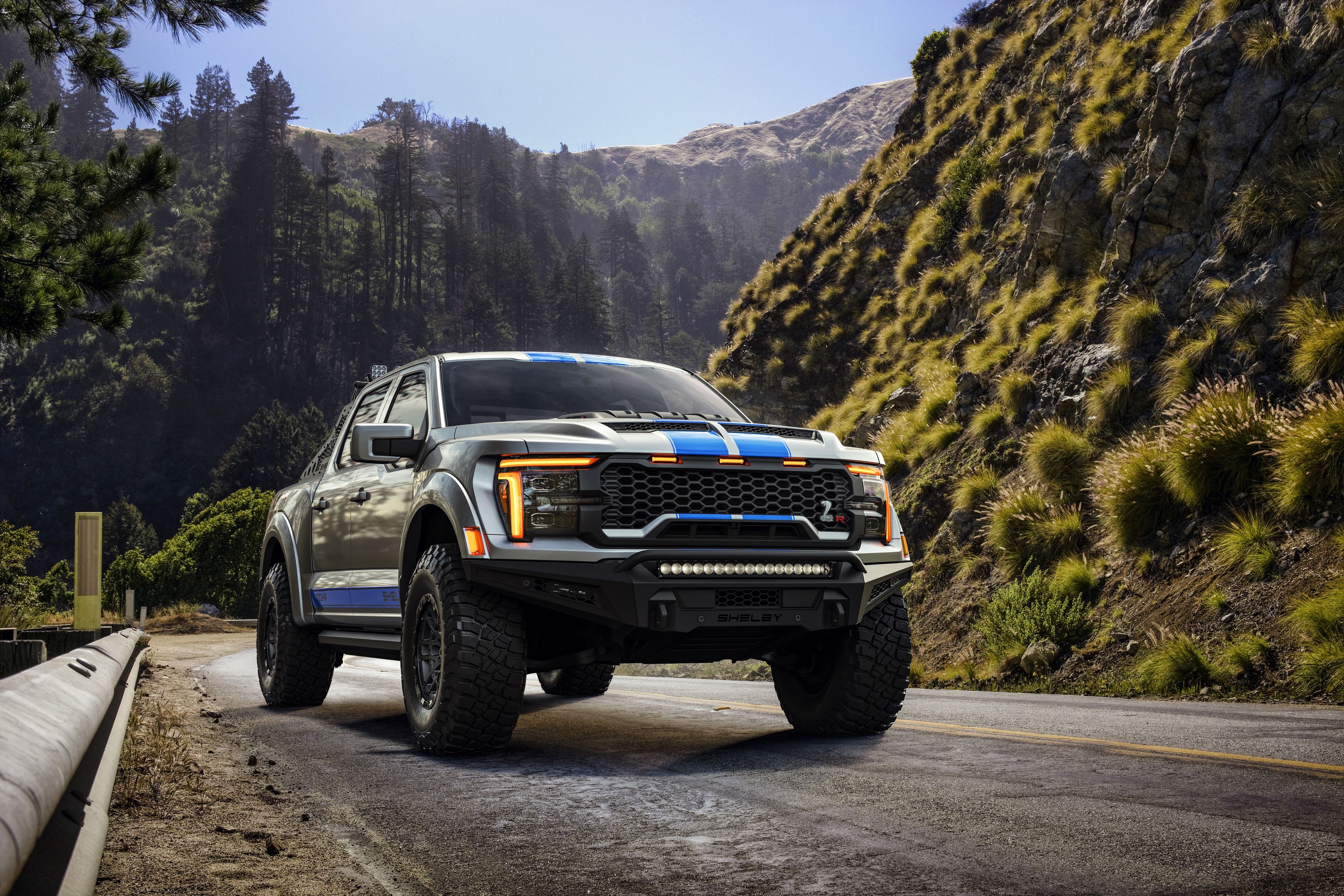 2026 Shelby Raptor R silver blue front 3/4 mountain road